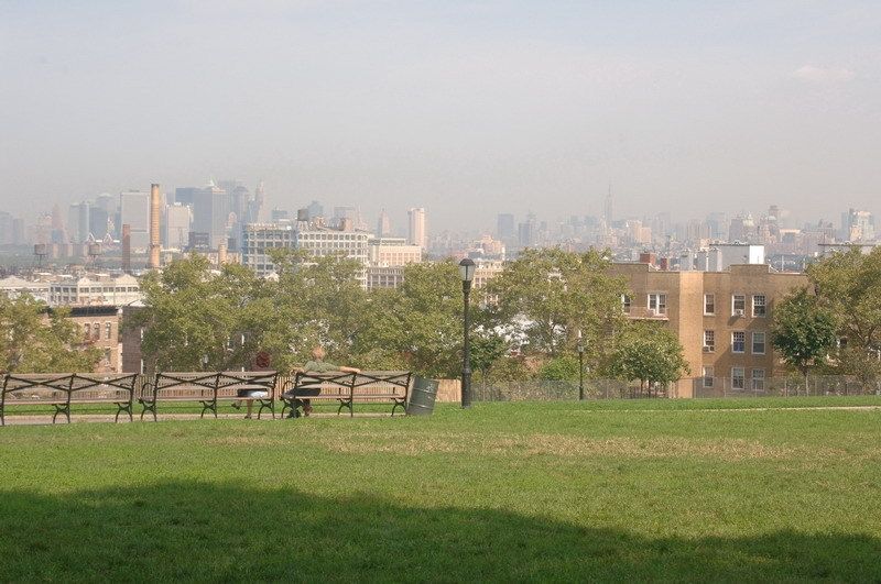 A park lawn looking out over the NYC skyline